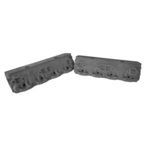 Two engine cylinder heads on white background.